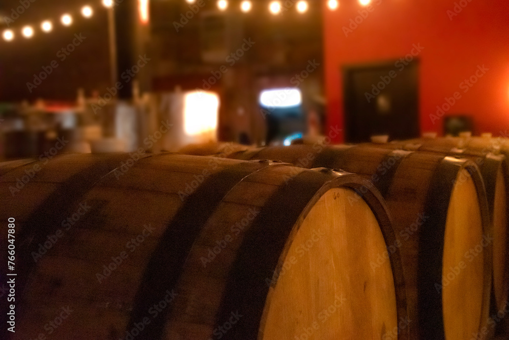 brewery barrels in a taphouse at night