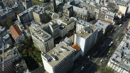 Aerial view tilting backwards over quartier Saint Ambroise, in sunny Paris, France photo