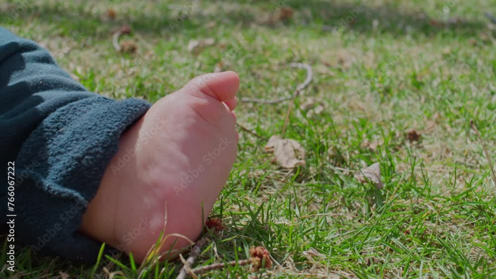 Closeup of a baby boy's feet in the grass Closeup of a baby boy's feet in the grass