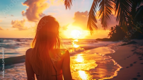 the essence of wanderlust with a woman admiring a stunning sunset over a tropical beach
