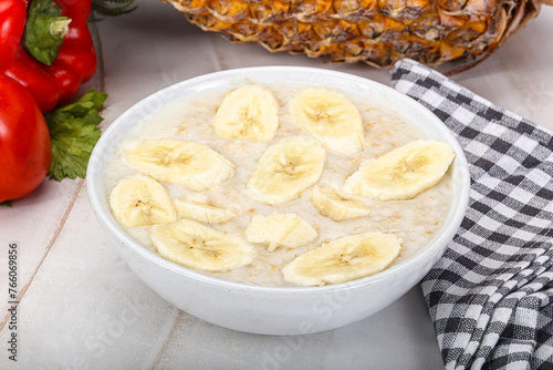 Sweet porridge with banana breakfast