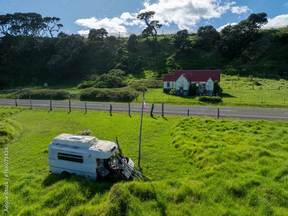 Abandoned vehicle along the coastline of Raukokore, Bay of Plenty, New Zealand. - obrazy, fototapety, plakaty 