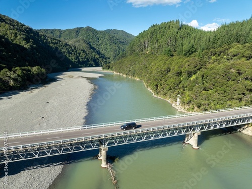 Bridge over the Haparapara river and hills Omaio, Ōpōtiki, Bay of Plenty, New Zealand.