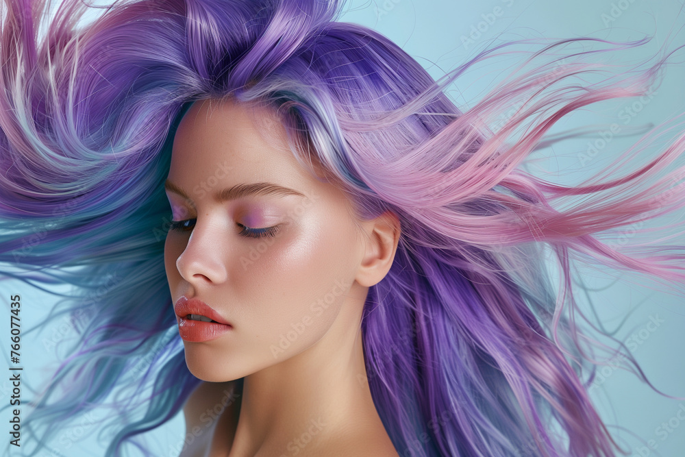 A woman with purple hair is the main focus of the image. The hair is long and flowing, giving the impression of movement and freedom. The woman's face is also prominent, with a smile