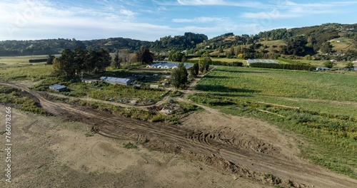 Silt and cleanup efforts one year after the Tropical Cyclone Gabrielle distaster that overflowed the Eskdale river. Eskdale, Napier, Hawkes bay, New Zealand. photo