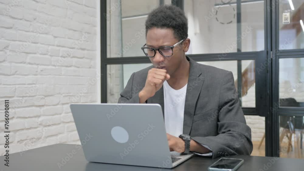 Young African Man having Cough at Work Young African Man having Cough at Work