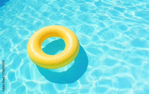 yellow swimming pool ring float in blue water