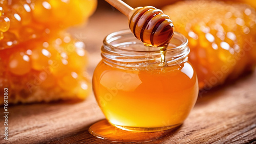 Honey dripping from a wooden honey dipper into a jar.