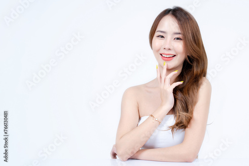 Asian woman with white strapless, Skincare and Cosmetology concept with white background, Free space for text, medium shot. 