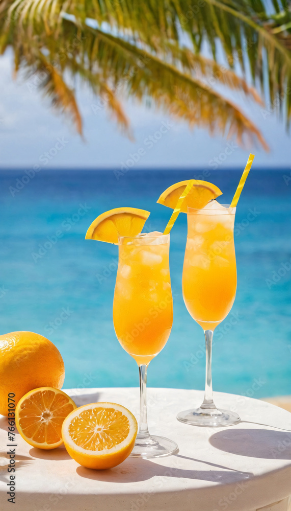 Cocktails with oranges and lemons stand on the seashore against Cocktails with oranges and lemons stand on the seashore against