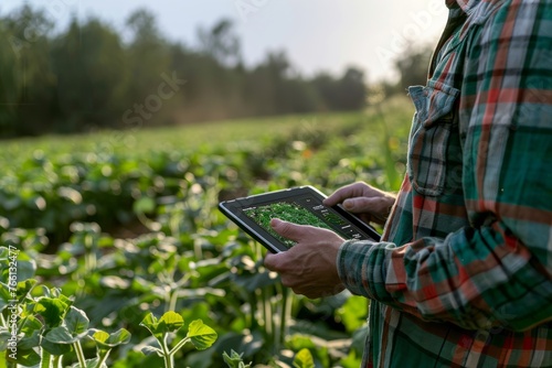Agricultural Technology: Farmer Using Tablet for Crop Analytics