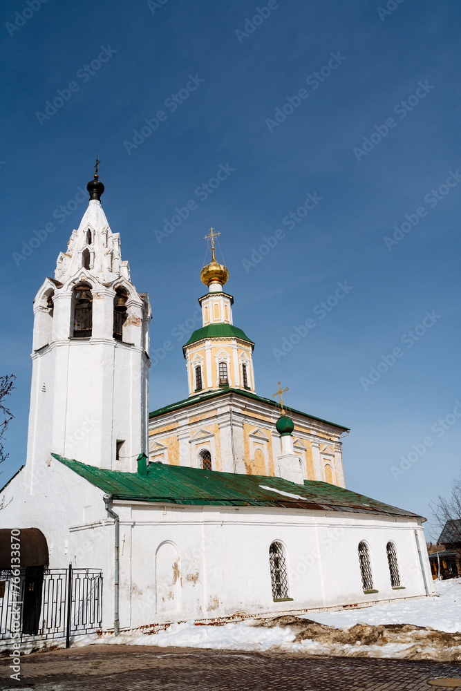 a white church with a green roof and a bell tower a white church with a green roof and a bell tower
