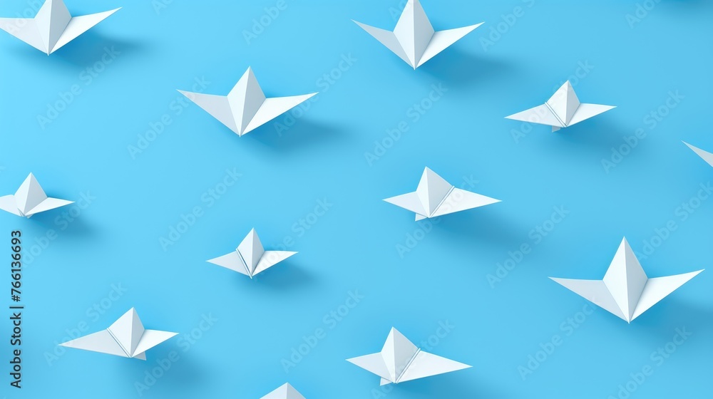 Origami figures on a blue background. Abstract figures made of paper. Origami figures on a blue background. Abstract figures made of paper.