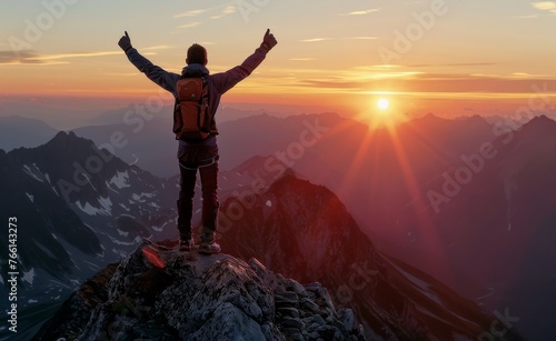 A mid-distance shot of a hiker reaching the summit of a mountain at dawn, celebrating personal achievement and the great outdoors.