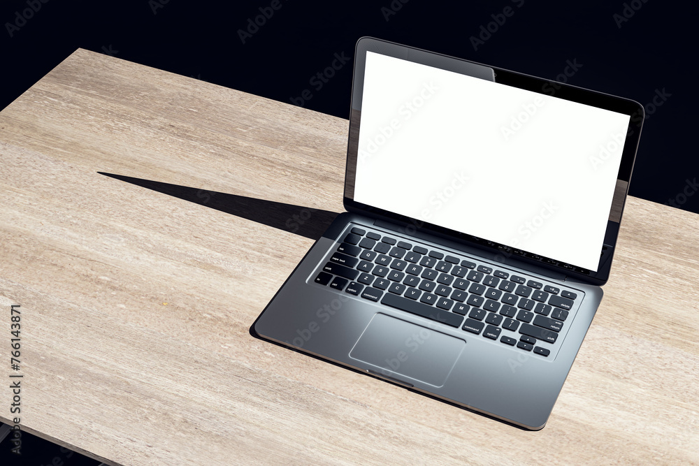 Top view of dark designer office workplace with white mock up laptop on wooden desk. 3D Rendering. Top view of dark designer office workplace with white mock up laptop on wooden desk. 3D Rendering.