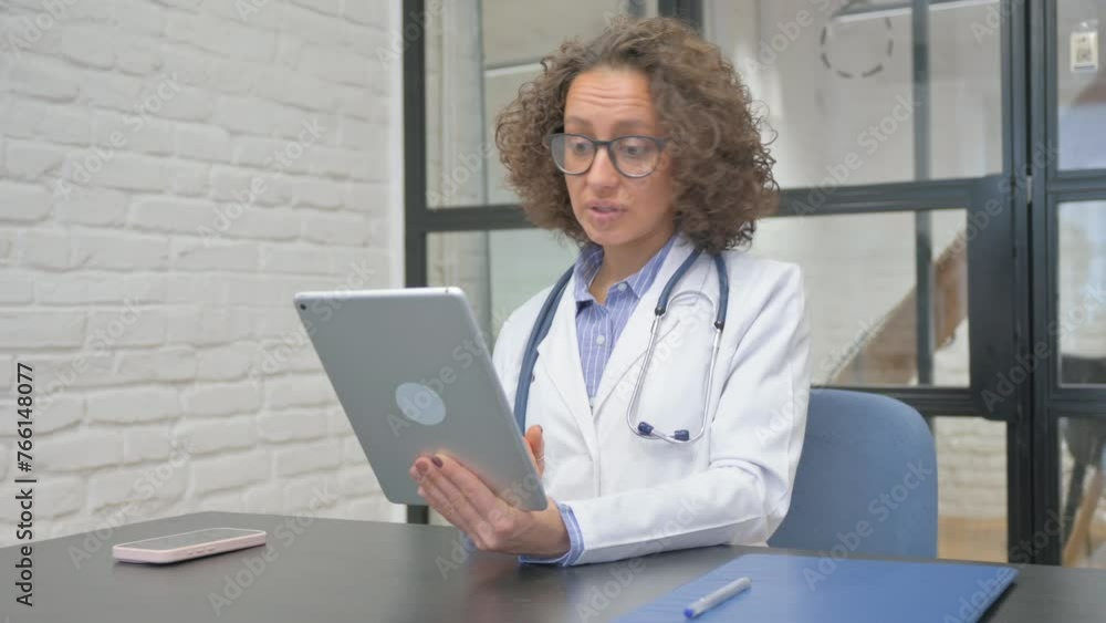 Hispanic Female Doctor Doing Video Chat on Tablet Hispanic Female Doctor Doing Video Chat on Tablet
