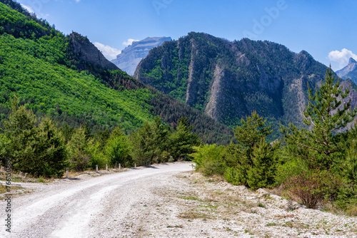 Amazing spring landscape in mountainous area. Mountains, valley and road from Gunib to Karadakh in Dagestan, Russia. Wonderful nature, beautiful natural background. Picturesque scenery