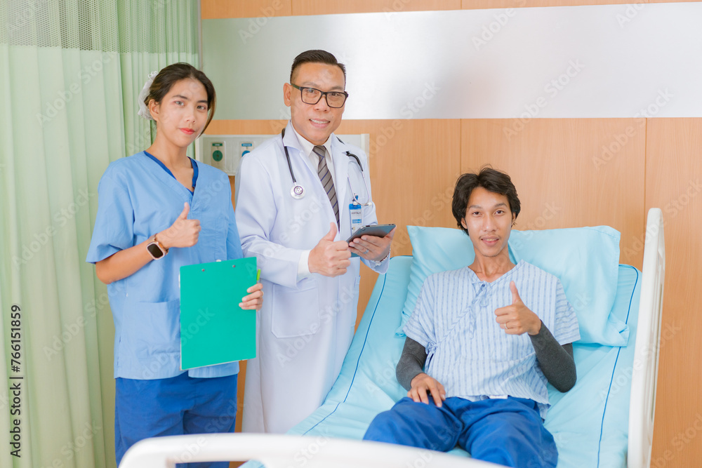 Obraz premium Hand of man doctor reassuring his male patient with thump up in bed at hospital. Medical ethics and trust concept..