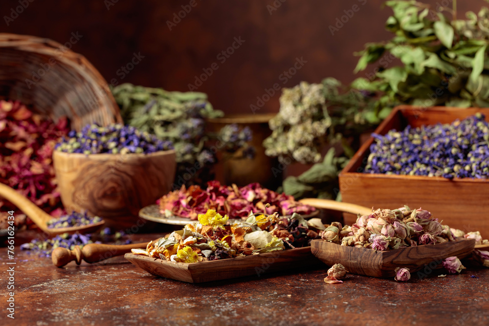 Various dried medicinal plants on a brown background. Various dried medicinal plants on a brown background.