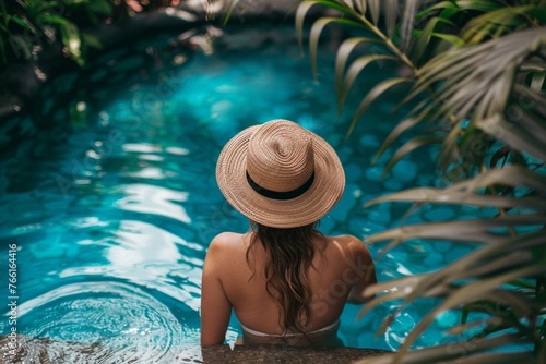 Woman at luxury resort poolside