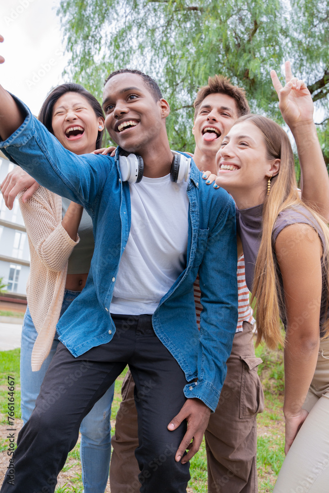 group of friends taking a selfie together and laughing together at the university.Technology or networking, connectivity and happy college people take a photo smiling for social media group of friends taking a selfie together and laughing together at the university.Technology or networking, connectivity and happy college people take a photo smiling for social media