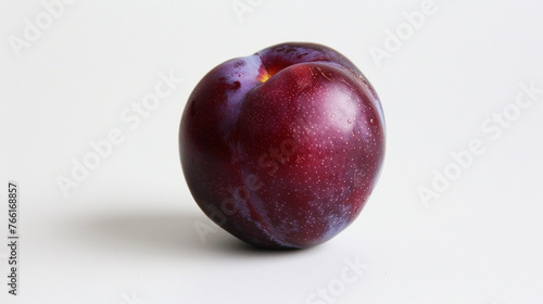 A single ripe plum placed delicately on a clean white background, highlighting its smooth skin and rich purple color. 