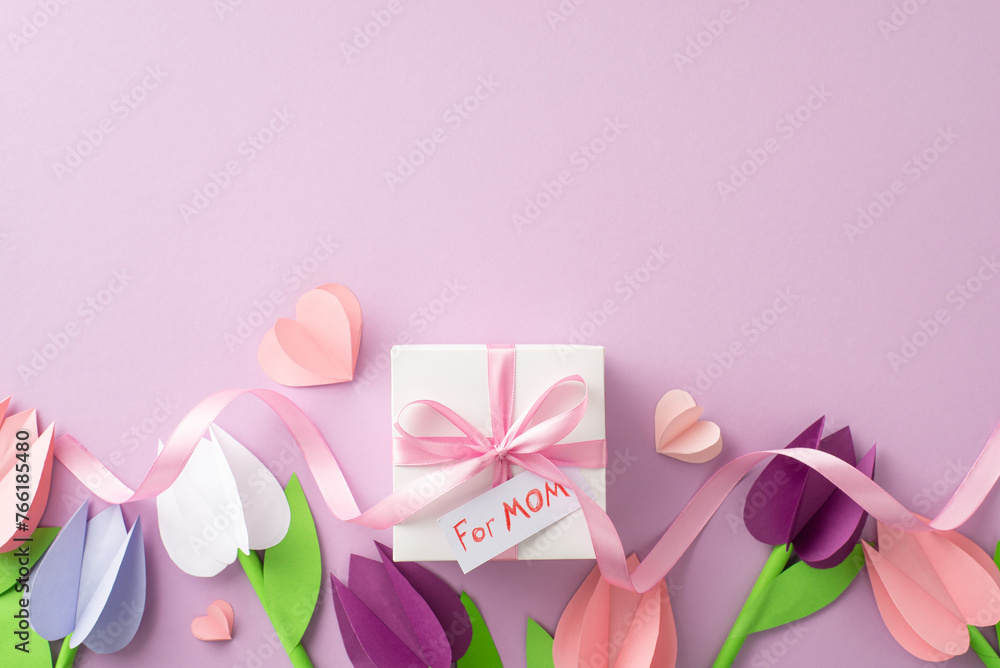 Mother's Day handmade delight: View from top of paper crafted tulips, present with ribbon and 