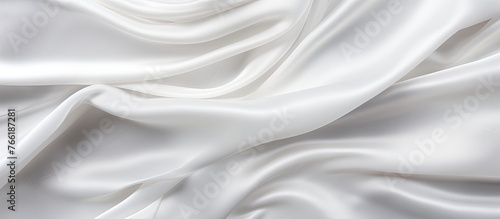 A close up of a white fabric displaying an extensive amount of intricate folds and creases, creating a textured surface