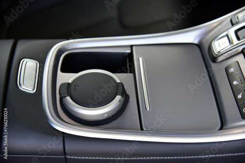 An ashtray on the console of a modern car