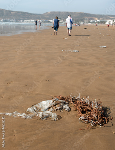 Agadir Morocco. Plastic pollution along the tide line of the beach. photo