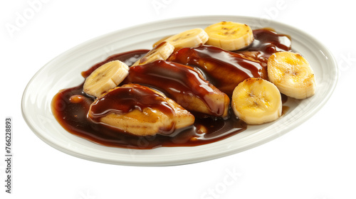 Homemade Bananas foster on plate, isolated white background