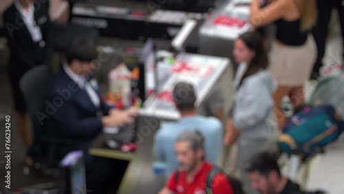 Wallpaper Mural Blurred and unrecognizable people waiting to check in at the airport. Airport check in area. 4K video with defocused effect. Torontodigital.ca