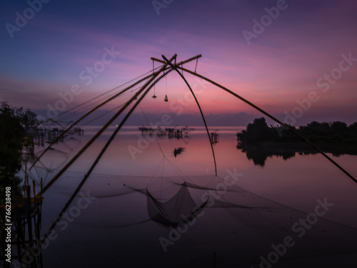 Beautiful landscape morning sky sunrise, Fishing using giant nets Thale Noi Wetlands at Baan Pak Pra is a famous landmark of Phatthalung, Thailand.