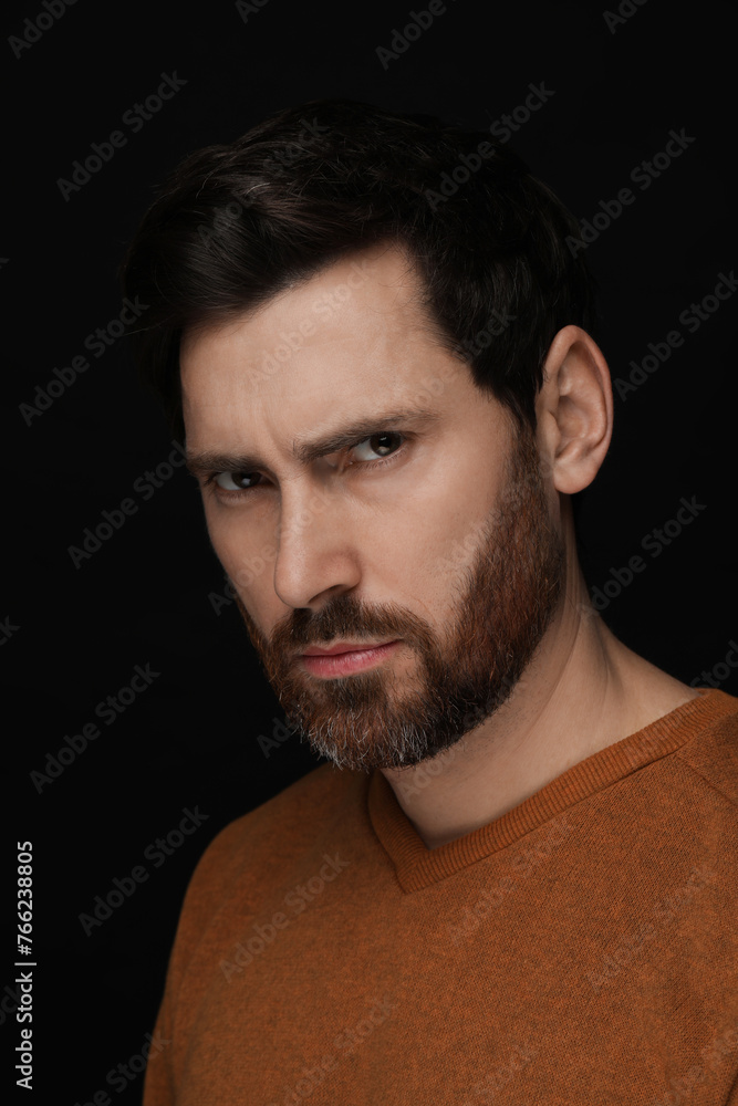 Obraz premium Evil eye. Man with scary eyes on black background