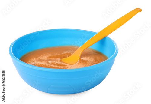 Tasty baby food and spoon in bowl isolated on white