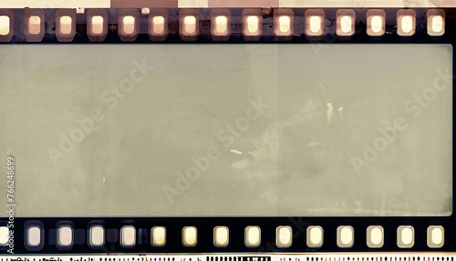 medium format filmstrip with grain textured and grunge border; old paper texture abstract background