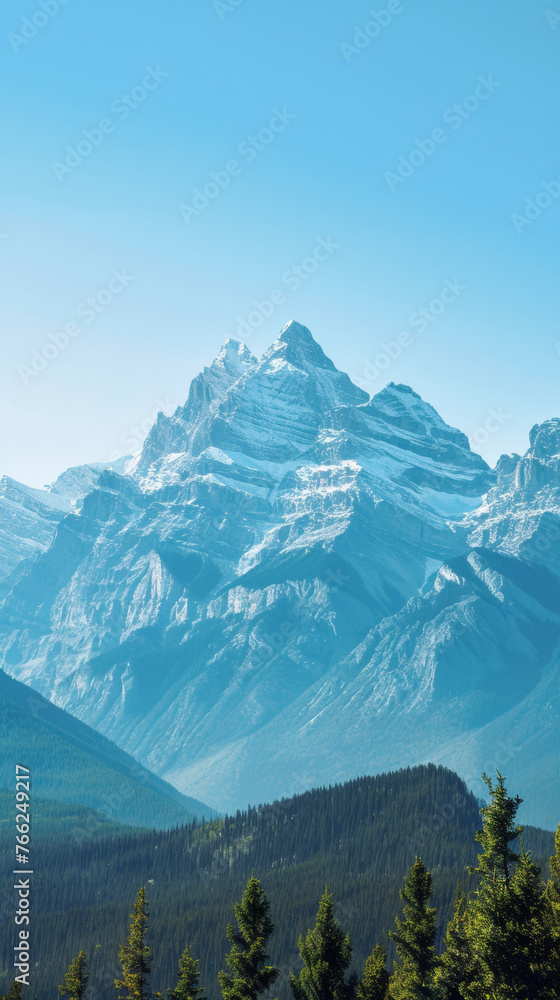Snowcovered mountain with trees in foreground, against blue sky. Generative AI
