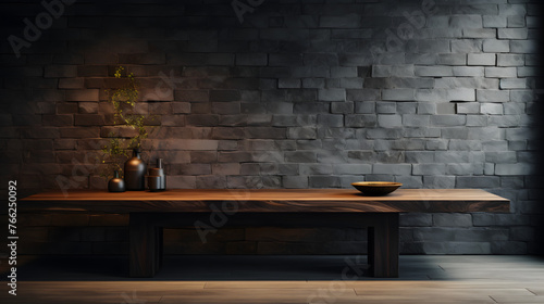 a wooden table with dark brick wall behind it