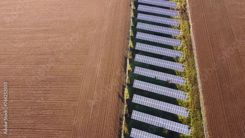 Solar panels farm in the middle of a plowed field