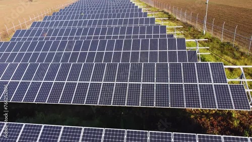 Solar panels farm in the middle of a plowed field