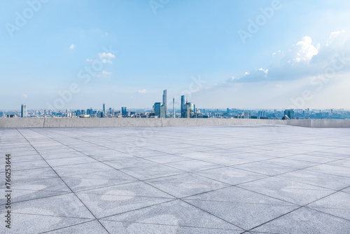 Empty square floor and modern city skyline