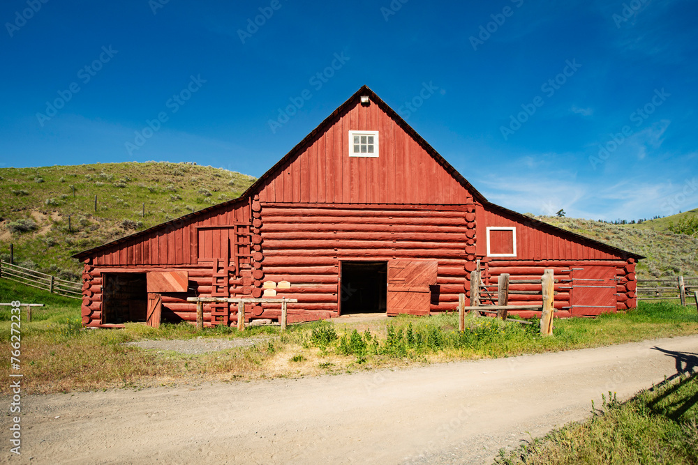 Old red wooden barn under blue sky, Canada Old red wooden barn under blue sky, Canada