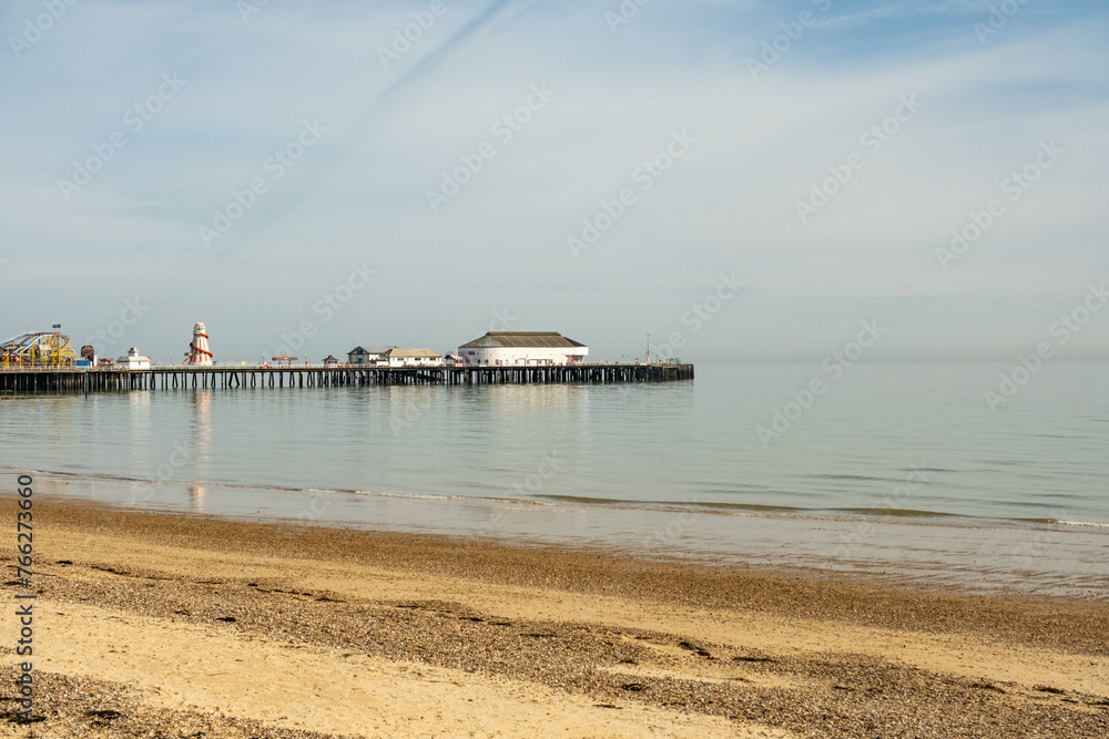 The sandy beach and Victorian pier in the coastal town of Clacton-on-Sea