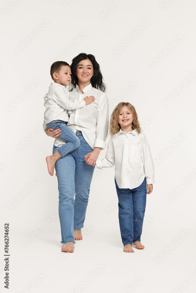 Little children with their mother on white background Little children with their mother on white background