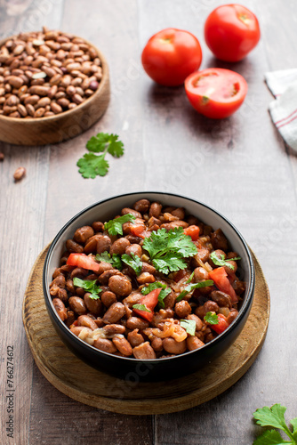  Vegetarian dish of stewed pink beans and tomatoes. A delicious bean dish served 