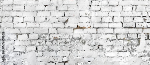 A monochrome photograph capturing a closeup of a white brick wall with peeling paint  showcasing the texture and pattern of the bricks