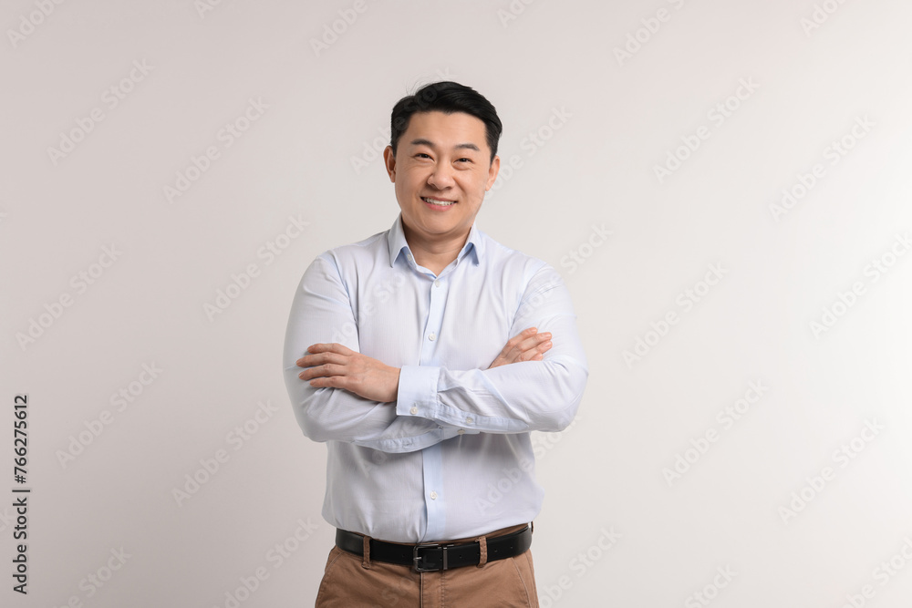 Portrait of happy man on light background Portrait of happy man on light background