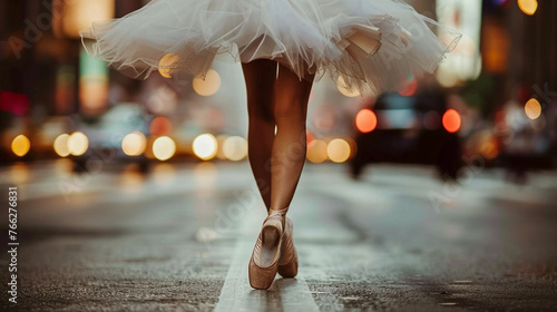 Ballerina dancing on the street, closeup on her legs and ballet shoes photo