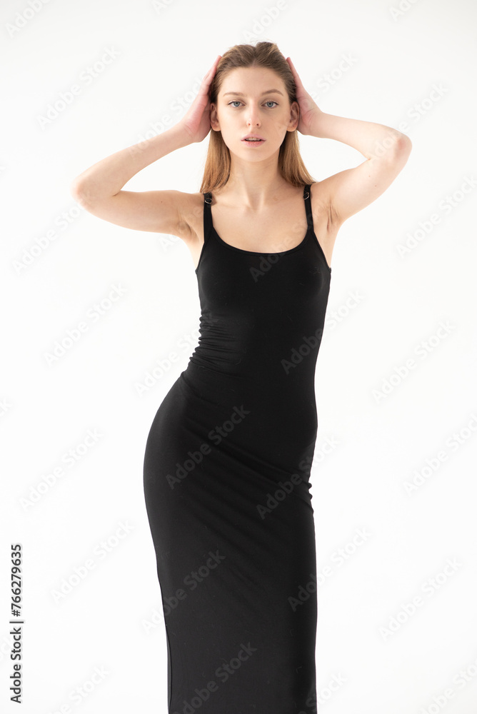 Snap Models. Full length portrait of a beautiful brunette woman in black bikini isolated on white background Snap Models. Full length portrait of a beautiful brunette woman in black bikini isolated on white background
