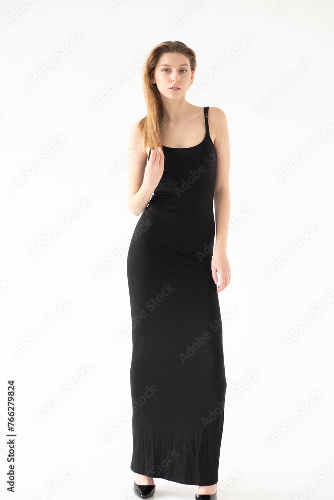Snap Models. Full length portrait of a beautiful brunette woman in black bikini isolated on white background Snap Models. Full length portrait of a beautiful brunette woman in black bikini isolated on white background